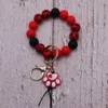 Bracelet imprimé de perle de perle en bois de perle de silicone à chaud de couleur chaude créative avec un bracelet pendentif et porte-clés et porte-clés en Europe et en Amérique personnalisés