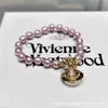 Charm av hög kvalitet Westwood Aleksa Baroque Pearl Armband Version Saturn