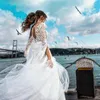 Sukienki imprezowe Temperament Suknia ślubna Wygląda na aplikację o doku z długim rękawem warstwowy puszysty tiul pure biała otwarta suknia ślubna