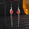 Boucles d'oreilles en peine-oreilles