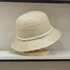 Bérets 2024 Fisherman d'été féminin Chapeau de seau lafite Bow Bow Ribbon Hepburn Girl Big Brim Casual Casc