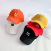 韓国の汎用性のあるM embroidered Children's Baseball Spring/Summer New Cute Smiling Face Baby日焼け止め舌帽子