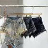 Dames shorts Buckle-breasted a-vormige hoog getailleerde denim voor vrouwen 2024 Zomer slanke ultra-short kwastje