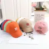 韓国の汎用性のあるM embroidered Children's Baseball Spring/Summer New Cute Smiling Face Baby日焼け止め舌帽子