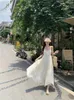 Casual Dresses Hanging Neck Design Chiffon Dress Women's Seaside Vacation French Open Back High-end Apricot White Long Skirt