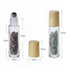 Garrafas de armazenamento 10pcs reki Cristal Healing Stones Roller Bottle com tampa de grãos de madeira plástica para óleo essencial 10ml