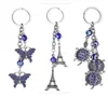 Butterfly chanceux et mauvais œil drôle Bonne chance Keychain Ring Handbag Charm Crystal Eiffel Tower Pendant Purse Sac Courterie Gift2857385
