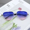 Nouveau métal à la mode Love Ocean Glass Sunglasses Peach Heart Womens Advanced Shaped