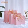 Gift Wrap 10 pieces of white pink gift bags with gold ribbons used for packaging kraft paper wedding boxes business shopping clothing packagingQ240511