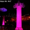 Decorazione di colonne gonfiabili a terra promozionale all'ingrosso con luci a LED e soffiatore d'aria libero per eventi o palcoscenici realizzati in Cina