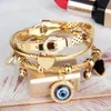 Высокие ювелирные браслеты и браслеты преувеличенные мульти-стильные висящие маленькие клавиши Голубые глаза из нержавеющей стали золотой браслет