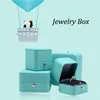 Enrole de presente nova caixa de anel de jóias de couro azul romântica Organizador de armazenamento de embalagens de embalagens usadas para proposentação de casamentoq240511