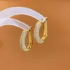 Charmsontwerper oorbellen Real Gold Pating zirkon letter d oorbellen mode sfeers atmosferische metalen studs gouden buckle eenvoudige oorbellen vrouwelijk 2024