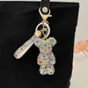 Keychains Lanyards Creative Full Rhinestone Crystal Keychains Lederen band Key Chain For Women Handtas Charm Hanger Auto Key Ring Fashion Beyrings T240509