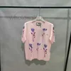 Projektantka koszulki damskiej 24 lato Nowy okrągły kwiat z nadrukiem jedwabna wełniana dzianina z krótkim rękawem wszechstronna t-shirt 9KFW