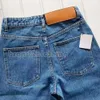 Designerin Frauen Jeans Ankunft High Wailstraße ausgehöhltes Patch Sticked Dekoration Casual Blue Straight Denim Hosen ausgehöhlt