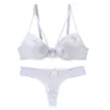 Reggiseni set nouvelle senza cucitura da donna sexy reggiseno usato per spingere il reggiseno fiore in pizzo abito da sera imbottito di filo top top dimensione Y240513