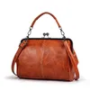 Sacs à main vintage pour femmes kiss kiss baiser verrouillage glisser le sac de couture texture crossbody sac 240508