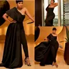 Zwarte jumpsuit prom -jurk met appliques pailletten een schouder overskirts Afrikaanse avondjurken met broekpakken plus size feestjurken 2807
