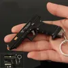 Mini Small Gun Pendant 1: 3 Nylon Pistol Gun Model Semi Legering TTig34 Metalen sleutelhanger afneembare hanger zonder te schieten