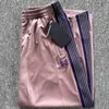 Pantalon large à rayures tricotées violet hommes femmes brodées pantalon papillon rose brun japon harajuku pantalon 240511