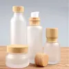 Bouteilles de crème en verre givré pots cosmétiques ronds Pumple de lotion face à main