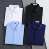 Tasarımcılar Bahar Sonbahar Uzun Kollu Tasarımcı Bowling Gömlek Erkek Moda Geometrik Mektup Baskı Düğmesi Aşağı Elbise Dönüş Gömlek Adam Artı Gömlek T8