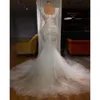 2024 Sexy Arabic Mermaid Wedding Dresses Illusion Scoop Neck Crystal Beads Pearls Long Sleeves Bridal Gowns Plus Size Sweep Train 0513