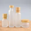 Bouteilles de crème en verre givré pots cosmétiques ronds Pumple de lotion face à main