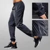 Spodnie męskie Szybkie suszenie Spodnie Spodnie Mężczyźni biegnący spodnie z kieszeniem na zamek błyskawiczne trening joggings sporty spodni fitness swobodny dres y240513