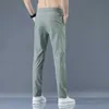 Pantalones para hombres Nuevos pantalones casuales para hombres primavera de primavera pantalones delgados delgados pantalones de moda macho estiramiento caqui jogging 28-38 y240513