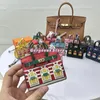 Mini Platinum Bag Little House Hanging Dekoration Süße kreative kleine Fensterautos Schlüsselkette Earphone -Tasche Großhandelspreis 240508