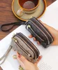 Kvinnors utsökta tryckta plånbok blixtlås multifunktionell mini handhållen plånbok handhållen väska