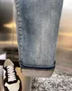 2024 Rua designer de moda jeans roxo botões voam em preto elástico elástico skinny jeans buttons mostro hip hop calça jeans para mulheres calças pretas brancas