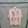 Projektantka koszulki damskiej 24 lato Nowy okrągły kwiat z nadrukiem jedwabna wełniana dzianina z krótkim rękawem wszechstronna t-shirt 9KFW