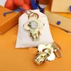 Keychains Lanyards Design -Tasche Charme Luxus Designer Paare Schlüsselkette Neue Sonnenblumenschlüsselringanhänger süße Pandahalter Modezubehör für Frauen Männer04