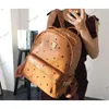 MCM1688 Backapck Leather Handbags en gros de grande taille, les hommes et les femmes voyagent célèbres Rivet Printing Backpack Designer Lady Sacs Boy Girl School Bag 118