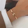 Celi New Fashion Alliage Couleur Préservant le bracelet plaqué or French French Triumphal Arch Design Femme