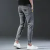 Hommes printemps et automne version coréenne confort stretch slim fashion skinny jeans pantalons designer vêtements 240513