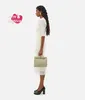 Designer Womens Bag Small Andiamo BotegaVenetas Small Intrecciato leather top handle bag with signature knot detail and sliding cross-body strap Travertine