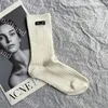 Frauen lässige Socken Lange Socken Hosiery Desgienr atmungsable Sportsock Brandbrief Stricksocke