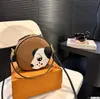 Designer Clutch Bag Round Bag Cowhide Leather Cartoon Dog Luxury Crossbody Bags Nano Handväskor Canvas Axelväskor Kvinnor Telefon Purses Makeup Bag Damer