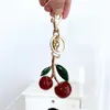 Śliczne wiśniowe torba z kluczem do dekoracji akcesorium czerwony różowy kryształowy wisiorek wiśniowy Złoty zielony liść wysokiej jakości kobiety luksusowe projektant