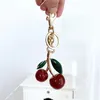 Cute Cherry Keychain Bag Charm Decoration Accessory Red Pink Crystal Cherry Pendant Decor gold Green Leaf High Quality Women Men Luxury Designer Apple Key Chain Gift