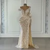 Vestidos de baile de sereia elegantes de champanhe sem mangas V Apliques de miçangas de pescoço lantejas de pérolas