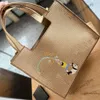 Été Nouveau panier de paille Sac panier de panier tissé en cuir tissé brodé