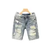 Fashion Summer Mens Blue Casual Solid Denim Jean Shorts avec des trous déchirés Wash Designer Clots Designer Mens Jeans 240513