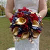Red roses, purple roses, golden calla lily combination wedding bouquet
