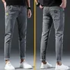 Hommes printemps et automne version coréenne confort stretch slim fashion skinny jeans pantalons designer vêtements 240513