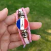 J'adore le bracelet rose Paris 2024 FRANCE FRACLE VERRE PHOTO PHOTO MAIN MAIN MAINT